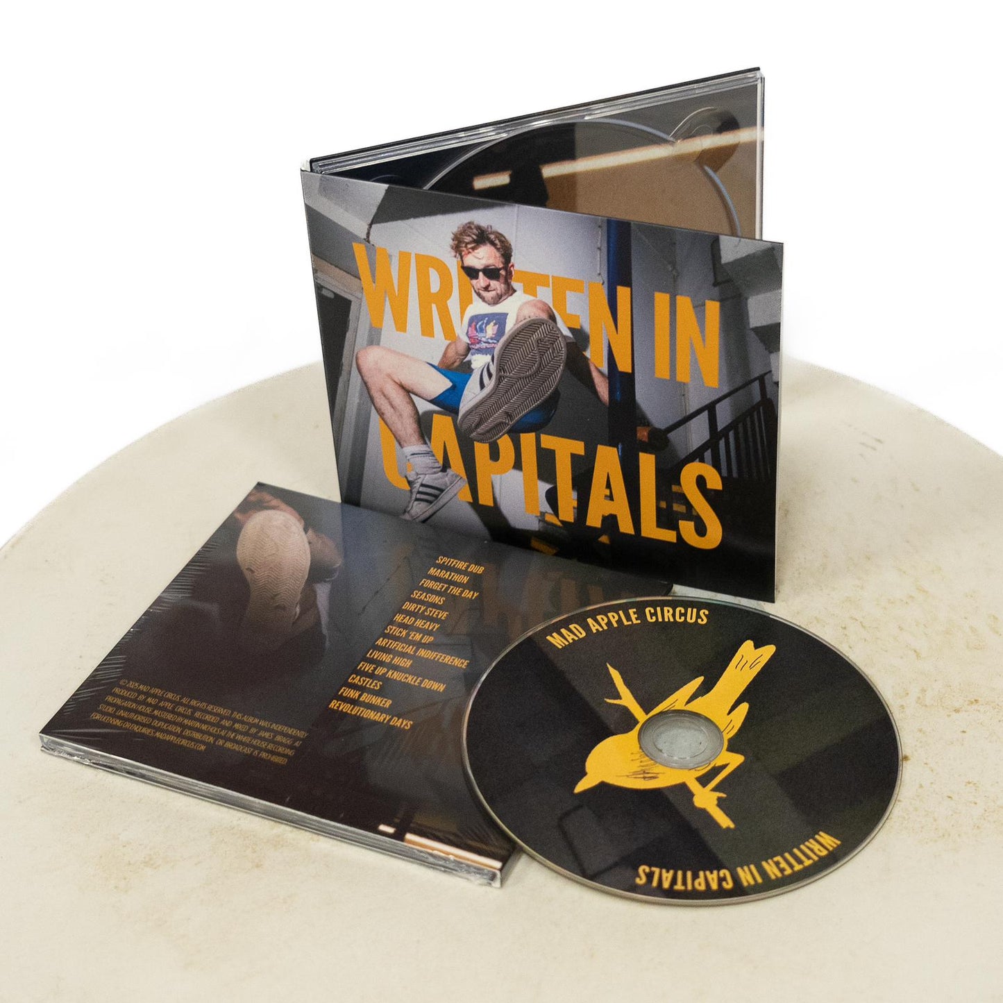 WRITTEN IN CAPITALS (2025) CD